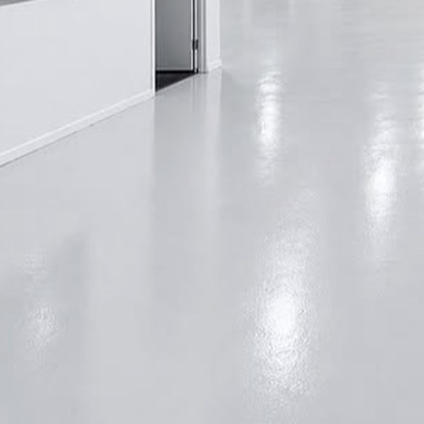 Smooth pale epoxy floor with a clean finish
